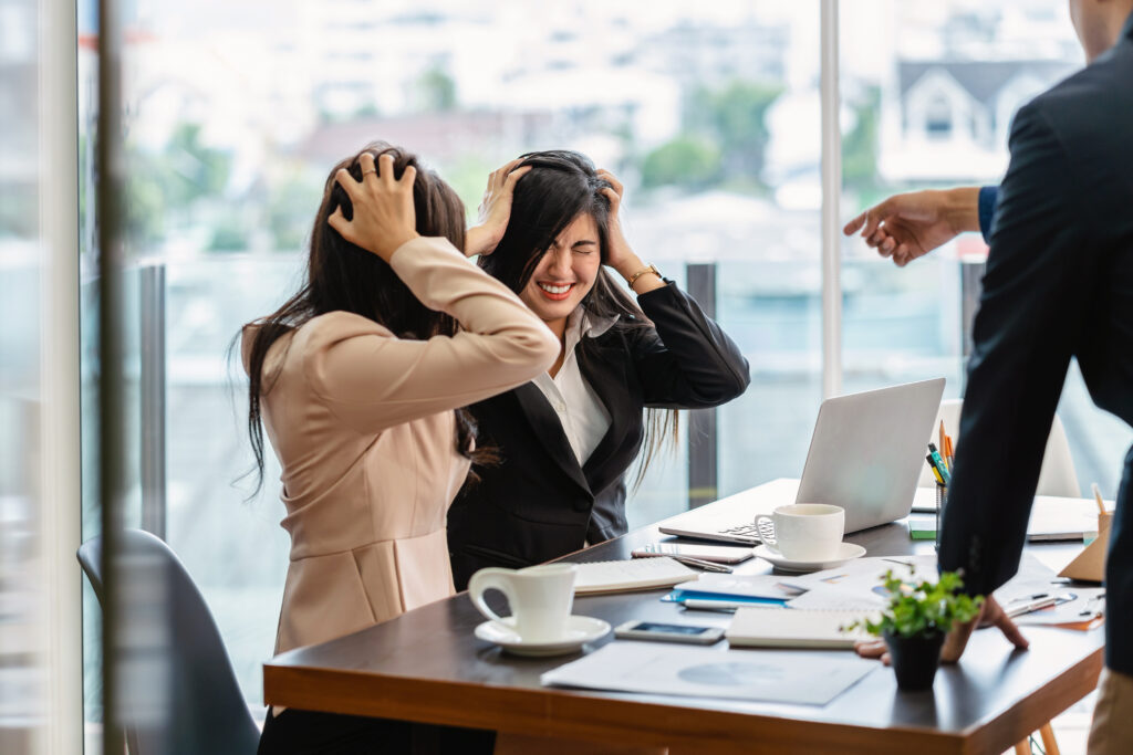 Scene of Furious boss scolding asian young couple businesswoman